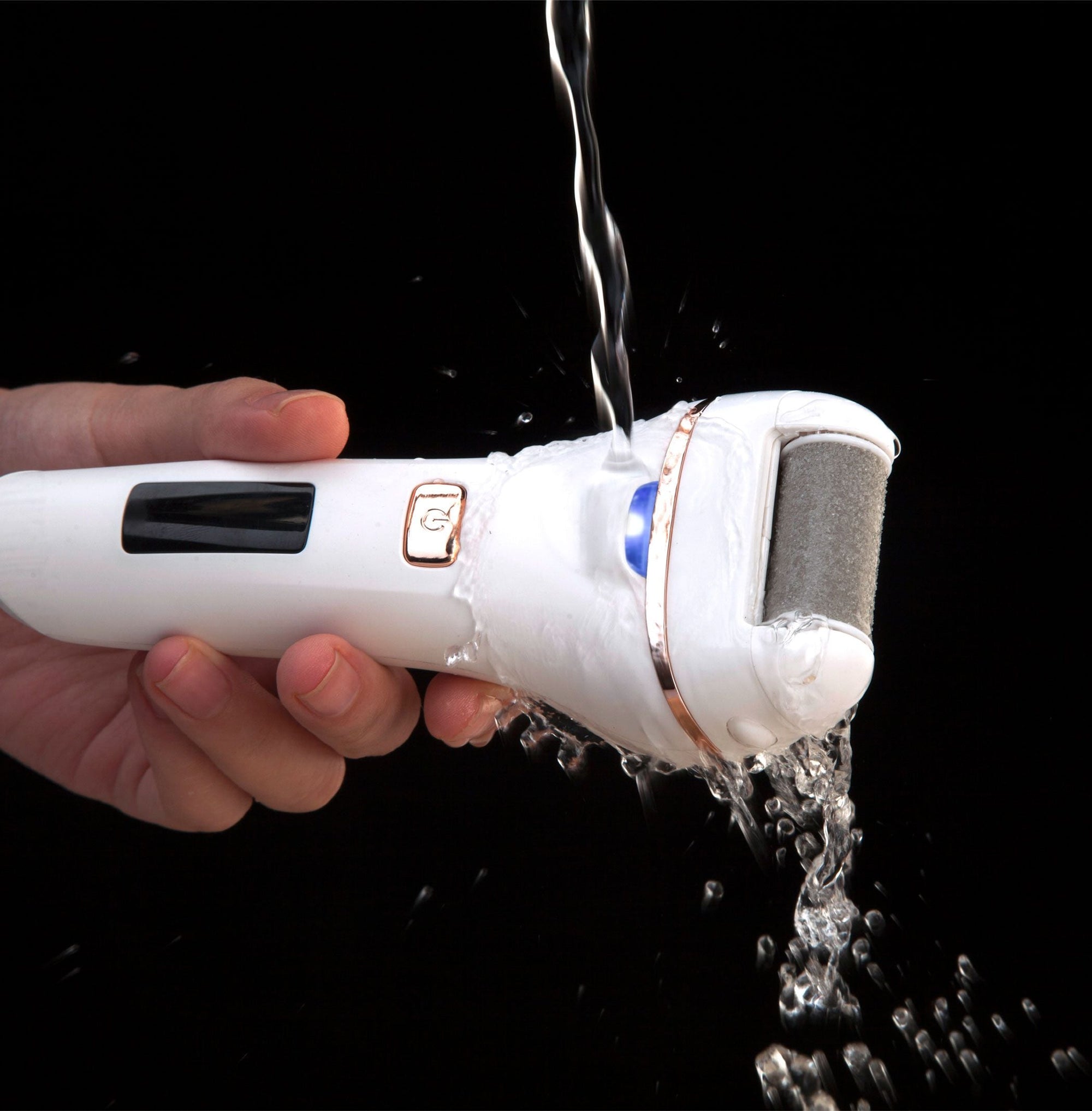 Go smooth 60 second pedi hard skin remover under running water to demonstrate IPX5 water resistant feature