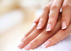 ladies hands with french gel manicured nails 