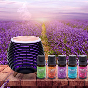 rio wellbeing collection aromatherapy oils 5 10ml bottles placed on wooden ledge next to a purple aroma diffuser with a lavender field backdrop 