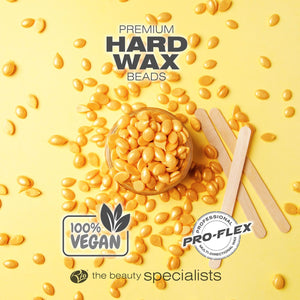 Honey premium hard wax beads laid out with spatulas labelled 100% vegan and professional pro-flex wax