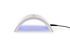 Salon Pro UV & LED Lamp with charging cable attached and blue light on