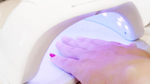 nails under UV Nail lamp 36w with dual LED with UV light curing gel manicure