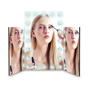 Premier Hollywood mirror with 20 LED lights and folding side mirrors showing reflection of ladies face applying mascara 
