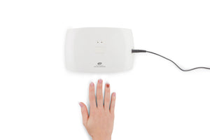 birdseye view of ladies manicured hand in front of Salon Pro UV & LED Lamp